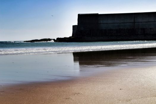 Beautiful beach called Praia da Torre in Lisbon, Portugal, in a sunny day of Spring
