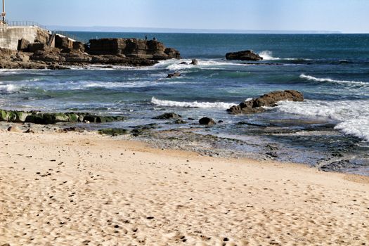Beautiful Azarujinha beach with rock formations in Estoril, Lisbon, Portugal, in a sunny day of winter