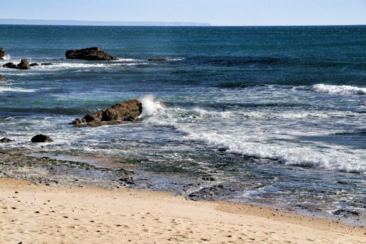Beautiful Azarujinha beach with rock formations in Estoril, Lisbon, Portugal, in a sunny day of winter