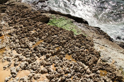Beautiful Azarujinha beach with rock formations in Estoril, Lisbon, Portugal, in a sunny day of winter