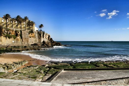 Beautiful Azarujinha beach with rock formations in Estoril, Lisbon, Portugal, in a sunny day of winter