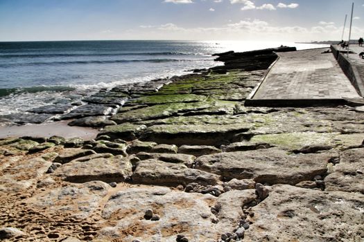 Beautiful Azarujinha beach with rock formations in Estoril, Lisbon, Portugal, in a sunny day of winter