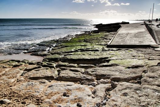 Beautiful Azarujinha beach with rock formations in Estoril, Lisbon, Portugal, in a sunny day of winter