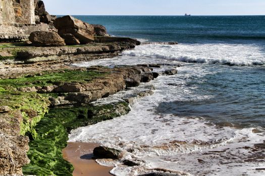 Beautiful Azarujinha beach with rock formations in Estoril, Lisbon, Portugal, in a sunny day of winter