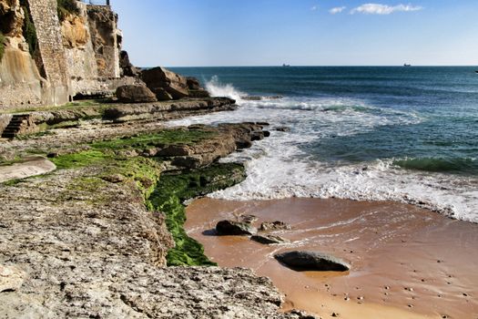 Beautiful Azarujinha beach with rock formations in Estoril, Lisbon, Portugal, in a sunny day of winter