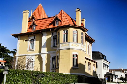 Beautiful and majestic houses in the coast of Estoril, Lisbon, Portugal, in a sunny day of winter.