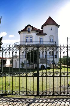 Beautiful and majestic houses in the coast of Estoril, Lisbon, Portugal, in a sunny day of winter.