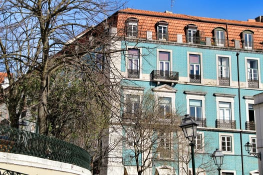 Narrow and colorful streets, majestic facades, windows and balconies of Lisbon, Portugal