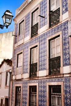 Narrow and colorful streets, majestic facades, windows and balconies of Lisbon, Portugal