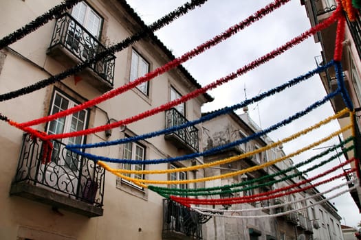 Narrow and colorful streets, majestic facades, windows and balconies of Lisbon, Portugal