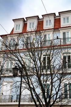 Narrow and colorful streets, majestic facades, windows and balconies of Lisbon, Portugal