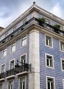Narrow and colorful streets, majestic facades, windows and balconies of Lisbon, Portugal