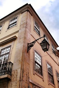 Narrow and colorful streets, majestic facades, windows and balconies of Lisbon, Portugal