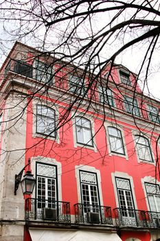 Narrow and colorful streets, majestic facades, windows and balconies of Lisbon, Portugal