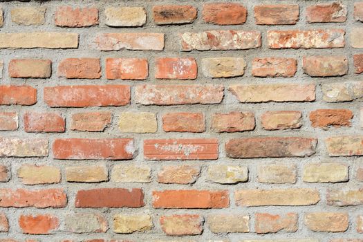 Detail of an old orange brick wall