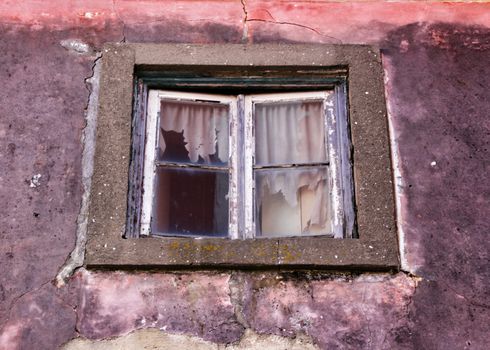 Old and colorful damaged facade in Lisbon 