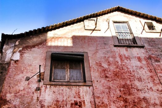 Old and colorful damaged facade in Lisbon 
