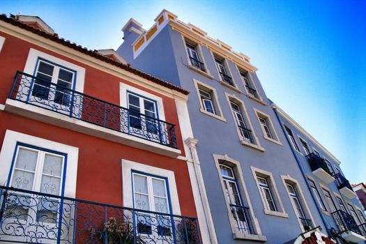 Old colorful houses and streets of Lisbon, Portugal in Spring. Majestic facades and old street lights.