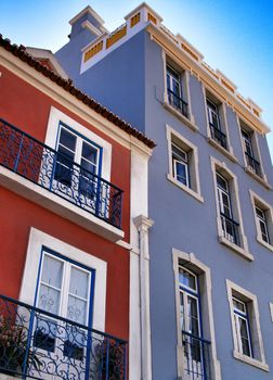 Old colorful houses and streets of Lisbon, Portugal in Spring. Majestic facades and old street lights.