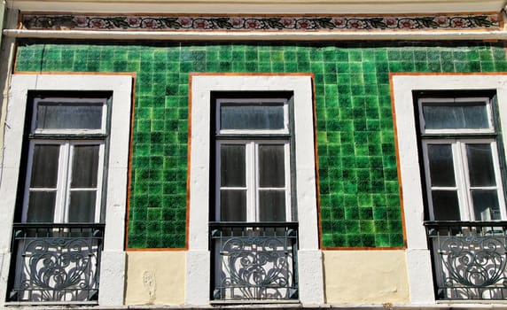 Old colorful houses and streets of Lisbon, Portugal in Spring. Majestic facades and old street lights.