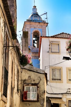 Old colorful houses and streets of Lisbon, Portugal in Spring. Majestic facades and old street lights.