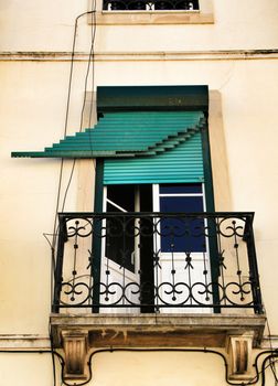 Old and colorful damaged facade in Lisbon