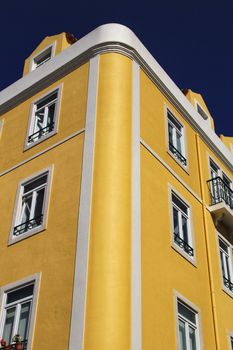 Old colorful houses and streets of Lisbon, Portugal in Spring. Majestic facades and old street lights.