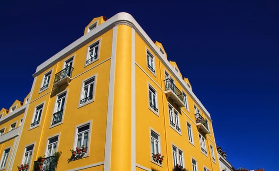 Old colorful houses and streets of Lisbon, Portugal in Spring. Majestic facades and old street lights.