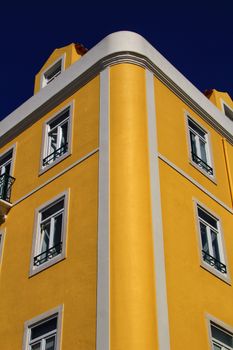 Old colorful houses and streets of Lisbon, Portugal in Spring. Majestic facades and old street lights.