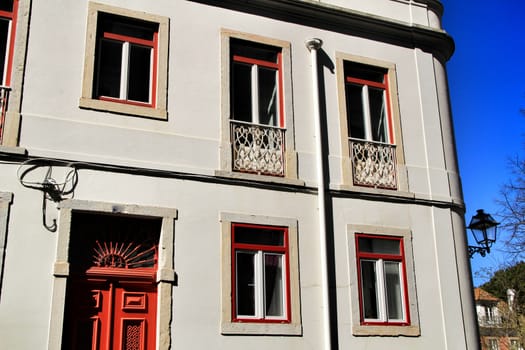 Old colorful houses and streets of Lisbon, Portugal in Spring. Majestic facades and old street lights.