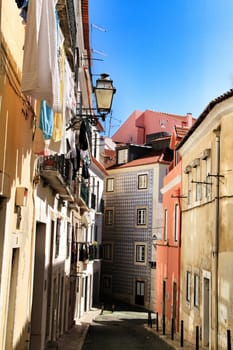 Old colorful houses and narrow streets of Lisbon, Portugal in Spring.