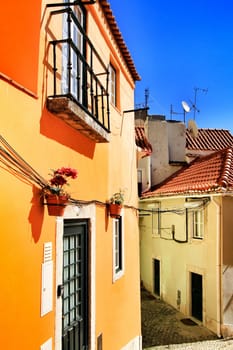 Narrow and colorful streets, majestic facades, windows and balconies of Lisbon, Portugal