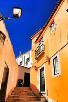 Narrow and colorful streets, majestic facades, windows and balconies of Lisbon, Portugal