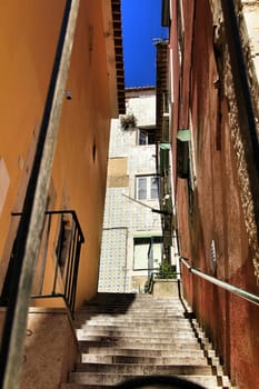 Narrow and colorful streets, majestic facades, windows and balconies of Lisbon, Portugal