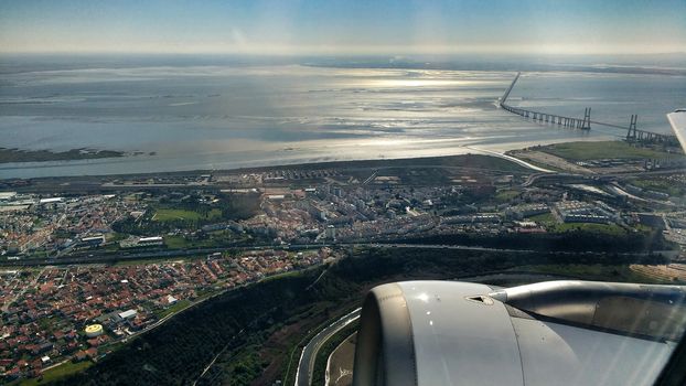 Aerial view of Lisbon and Tagus River. Vasco da Gama bridge in the background