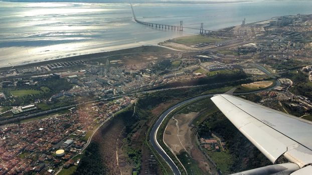 Aerial view of Lisbon and Tagus River. Vasco da Gama bridge in the background