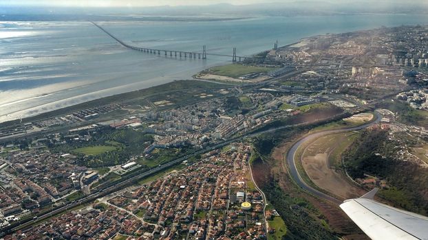 Aerial view of Lisbon and Tagus River. Vasco da Gama bridge in the background