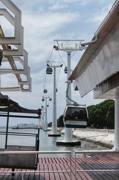 Cable car under cloudy sky in the Park of Nations in Lisbon, Portugal