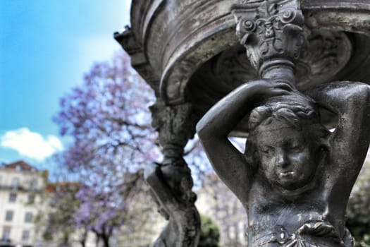 Beautiful stone fountain at Rossio Square in Lisbon, Portugal