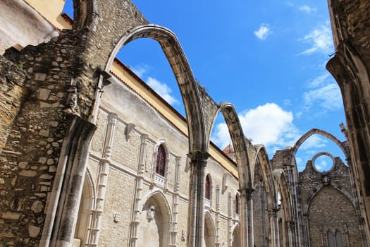 Arcades, pillars and facade of Do Carmo convent in Lisbon, Portugal