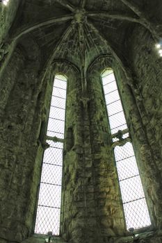 Arcades, pillars windows and details of Do Carmo convent in Lisbon, Portugal