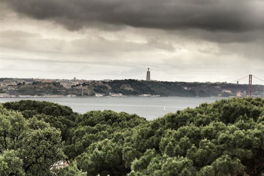 Panoramic of the Tagus River and vegetation from the Castle of San Jorge on a cloudy day in Spring