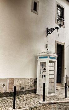 Old and colorful public telephone box in Lisbon