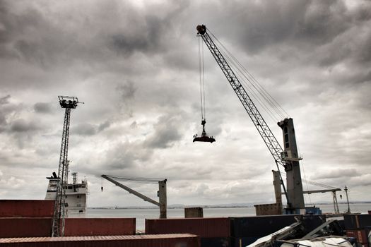 Crane and containers on the dock in the port of Lisbon, Portugal