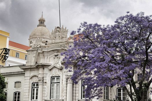 Majestic facades of Lisbon city and The National Pantheon in the background on a cloudy day of Spring