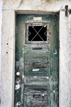 Old and colorful wooden door with iron details in Lisbon, Portugal