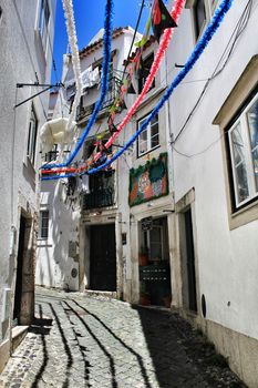 Lisbon, Portugal- June 4, 2018: Streets adorned with garlands for the festivities of Saint Anthony in the Alfama neighborhood in Lisbon