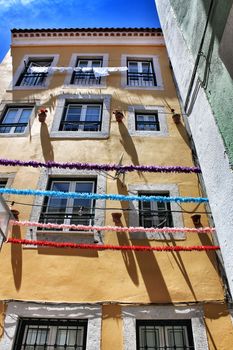 Streets adorned with garlands for the festivities of Saint Anthony in the Alfama neighborhood in Lisbon