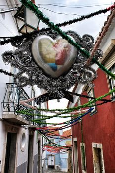 Streets adorned with garlands for the festivities of Saint Anthony in the Alfama neighborhood in Lisbon