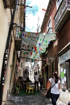 Lisbon, Portugal- June 8, 2018: Streets adorned with garlands for the festivities of Saint Anthony in the Alfama neighborhood in Lisbon